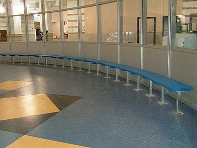 curved bench in lobby of ice rink