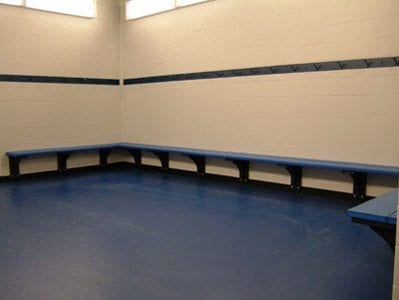 benches and hooks on wall in locker room