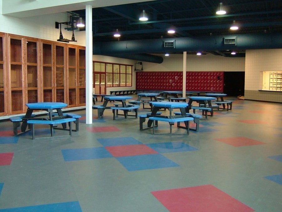 lobby with blue hex picnic tables