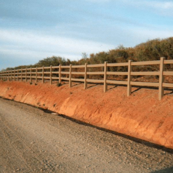 3-rail fence along gravel road
